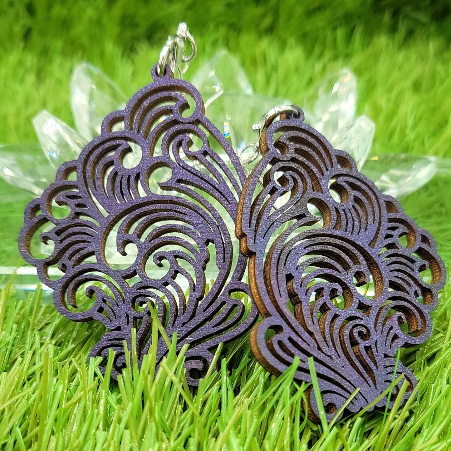 A captivating pair of Boujee Stoner Vapor Earrings crafted from purple unicorn wood, showcasing their deep purple tones and intricate design.