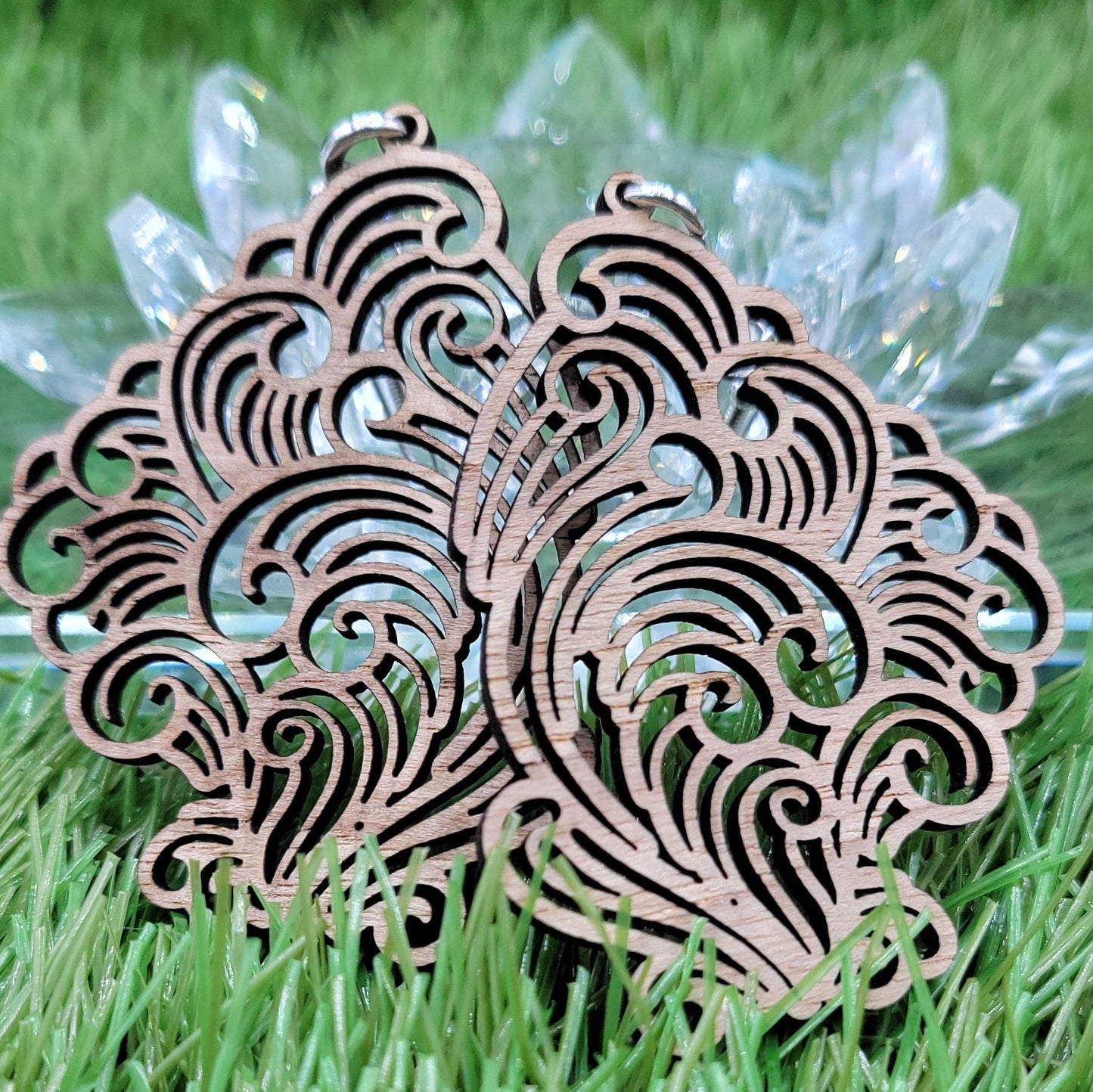 Close-up of a pair of Boujee Stoner Vapor Earrings made from spalted maple wood, showcasing their intricate swirling patterns and natural beauty.